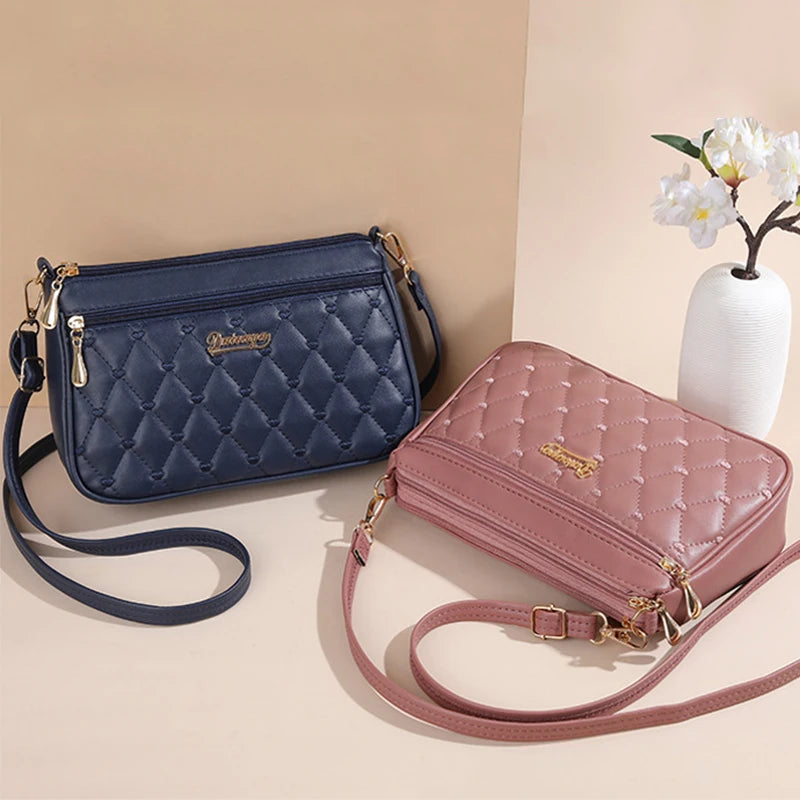 Bolsa Emery de Couro com Alça Transversal e Zíper