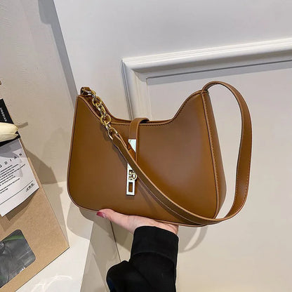 Bolsa Elowen de Ombro Compacta de Couro com Fechadura Magnética